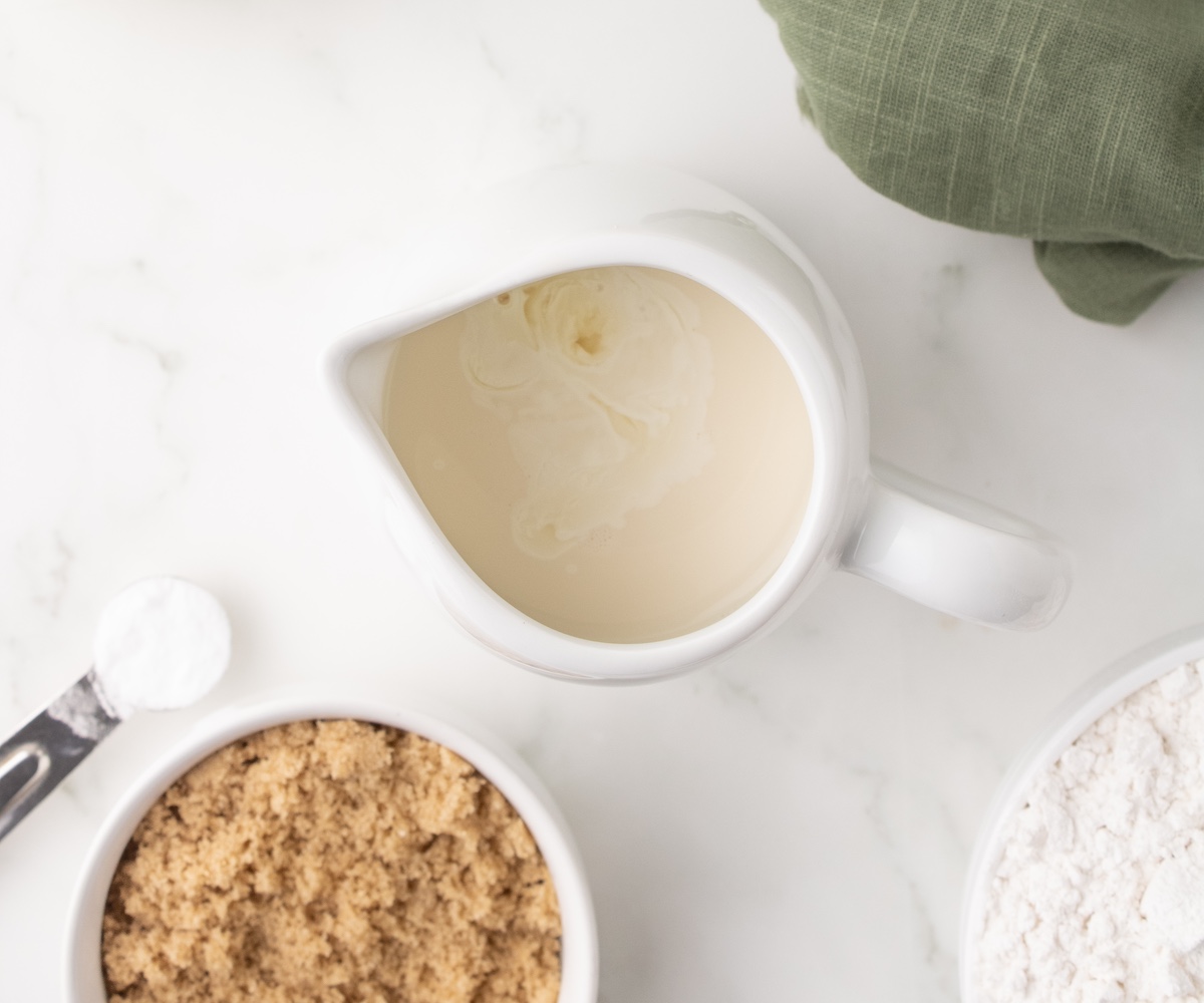 milk and vinegar sitting in a small pitcher