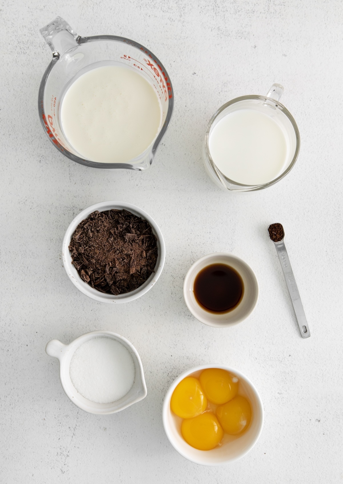 Heavy whipping cream, whole milk, chocolate, egg yolks, sugar, espresso powder, and vanilla