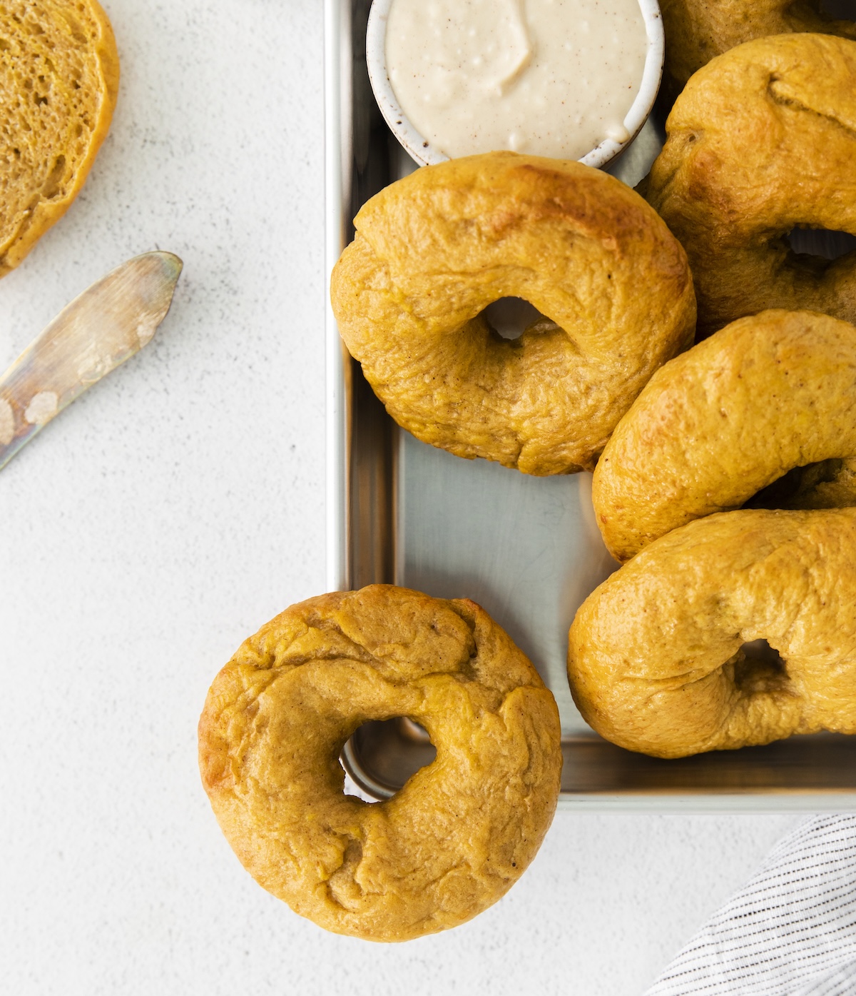 plate of pumpkin bagels with maple cream cheese