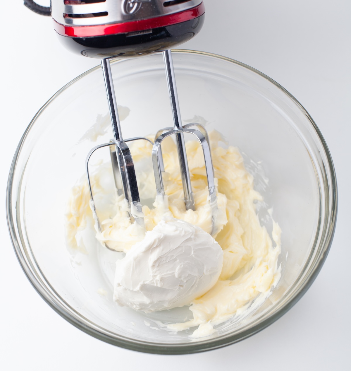 Adding cream cheese to the creamed butter