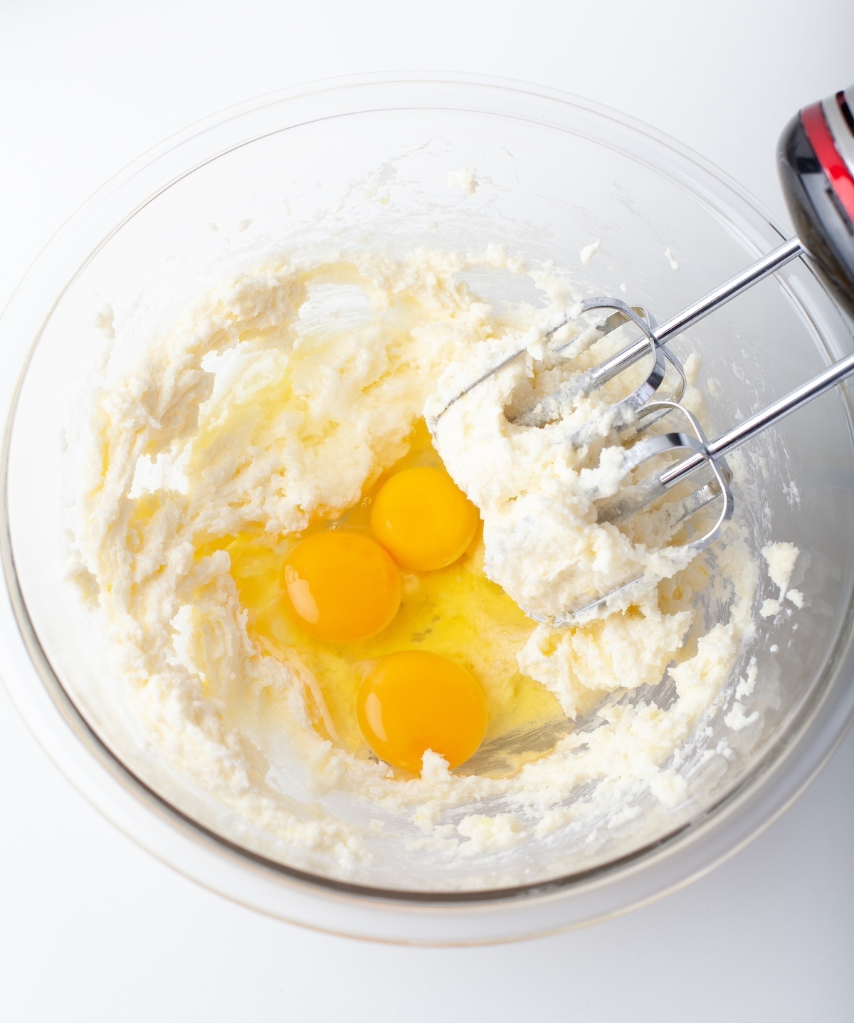 Adding lemon juice, zest, and eggs into the butter mixture