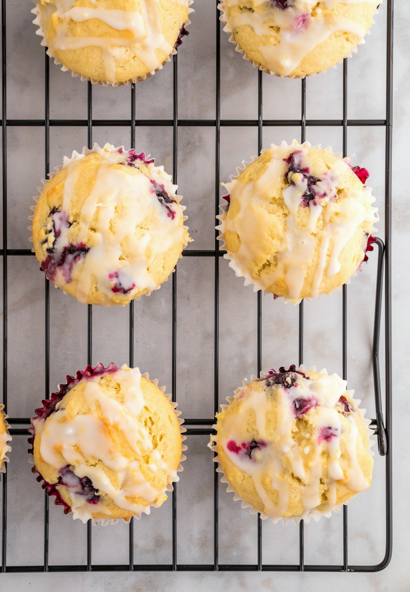 Allowing the glaze to set on the muffins