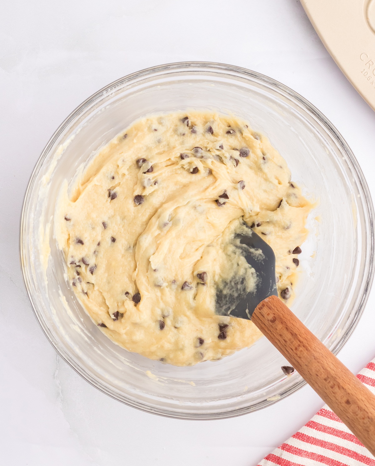 Folding the chocolate chips into the muffin batter
