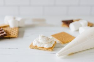 Mixture piped onto a graham cracker