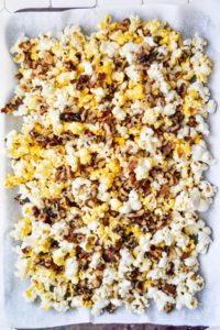 Walnuts sprinkled over popcorn