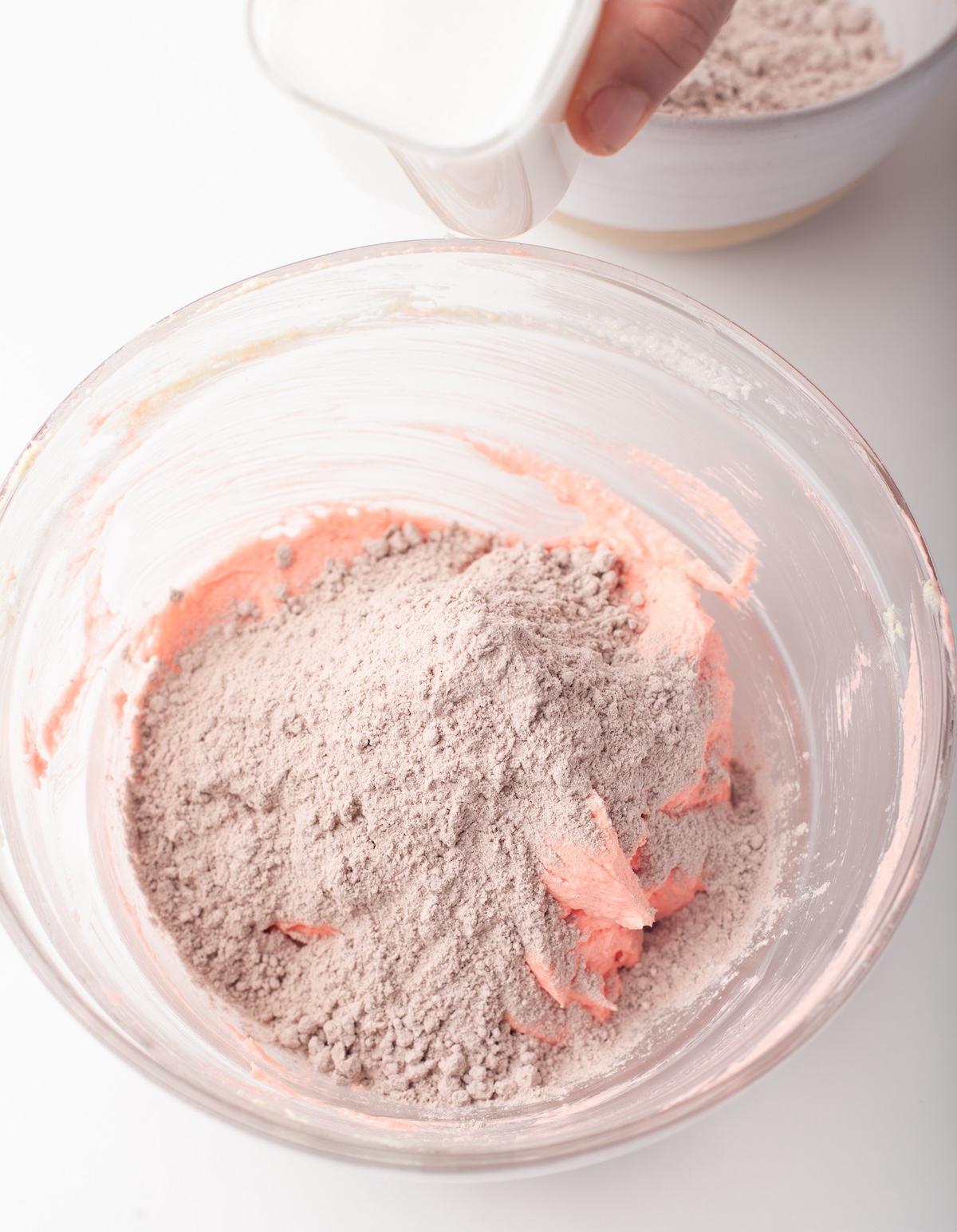 adding half the dry ingredients and milk into the batter