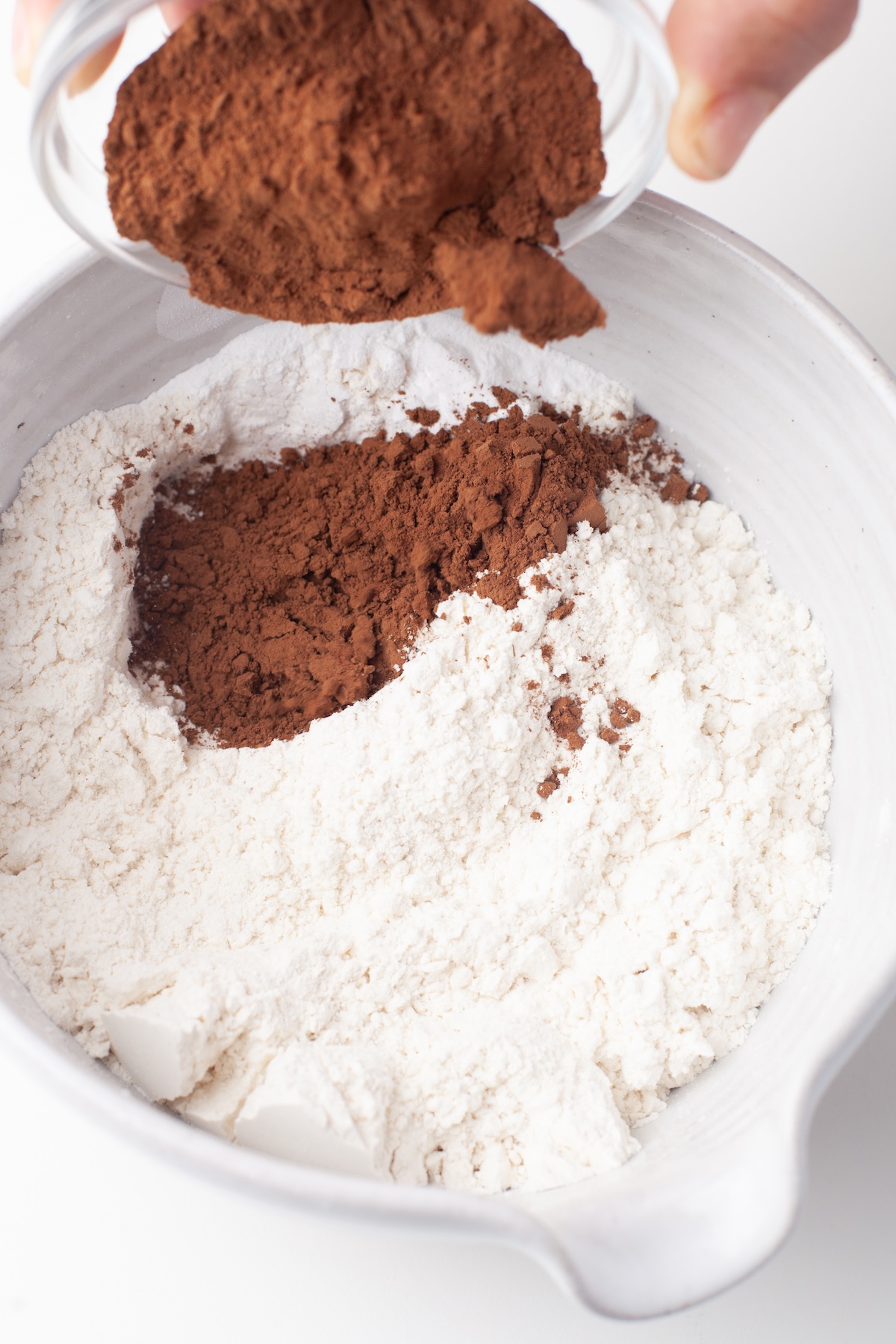 flour, cocoa powder, baking powder, and baking soda together
