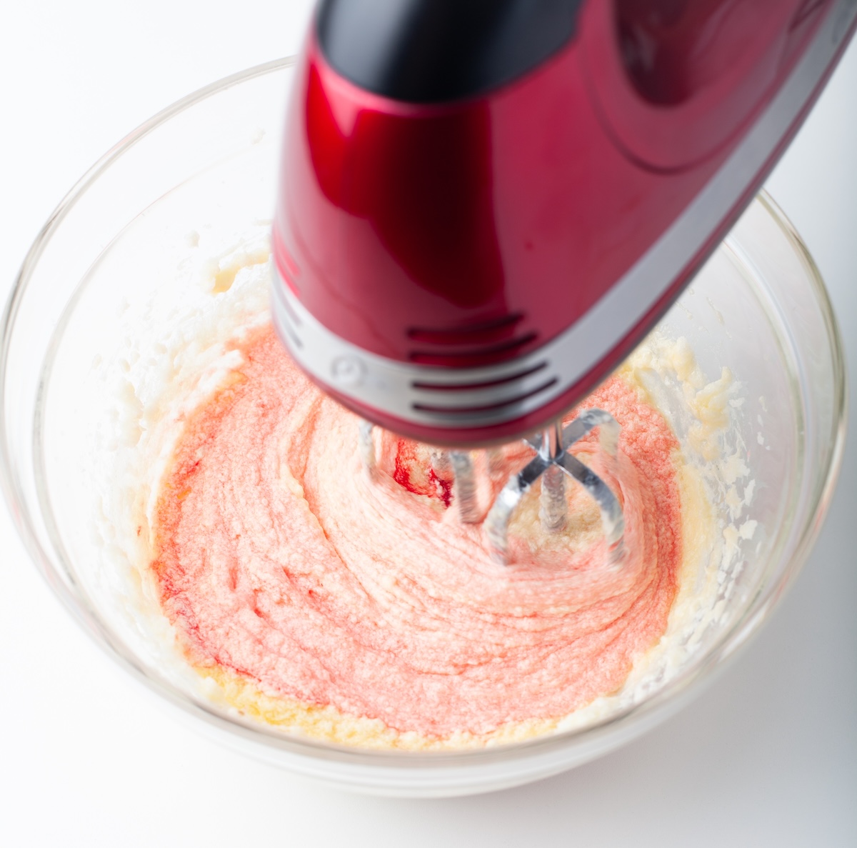 mixing red dye into the batter
