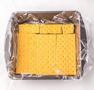 pan lined with graham crackers across the bottom