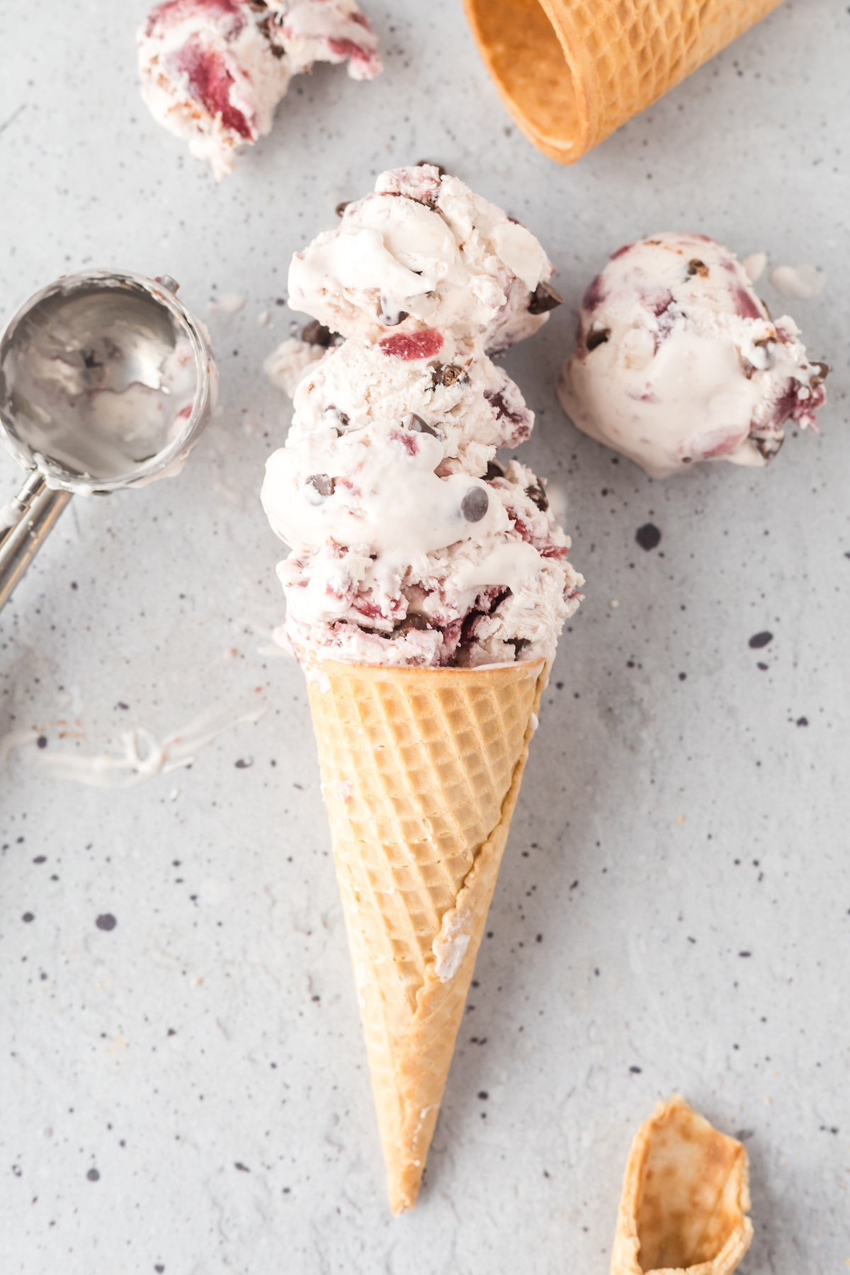 chocolate cherry ice cream in a cone