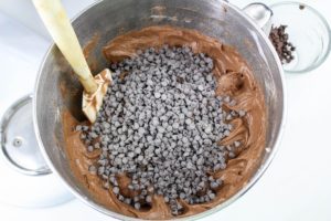 mixing chocolate chips into the chocolate batter