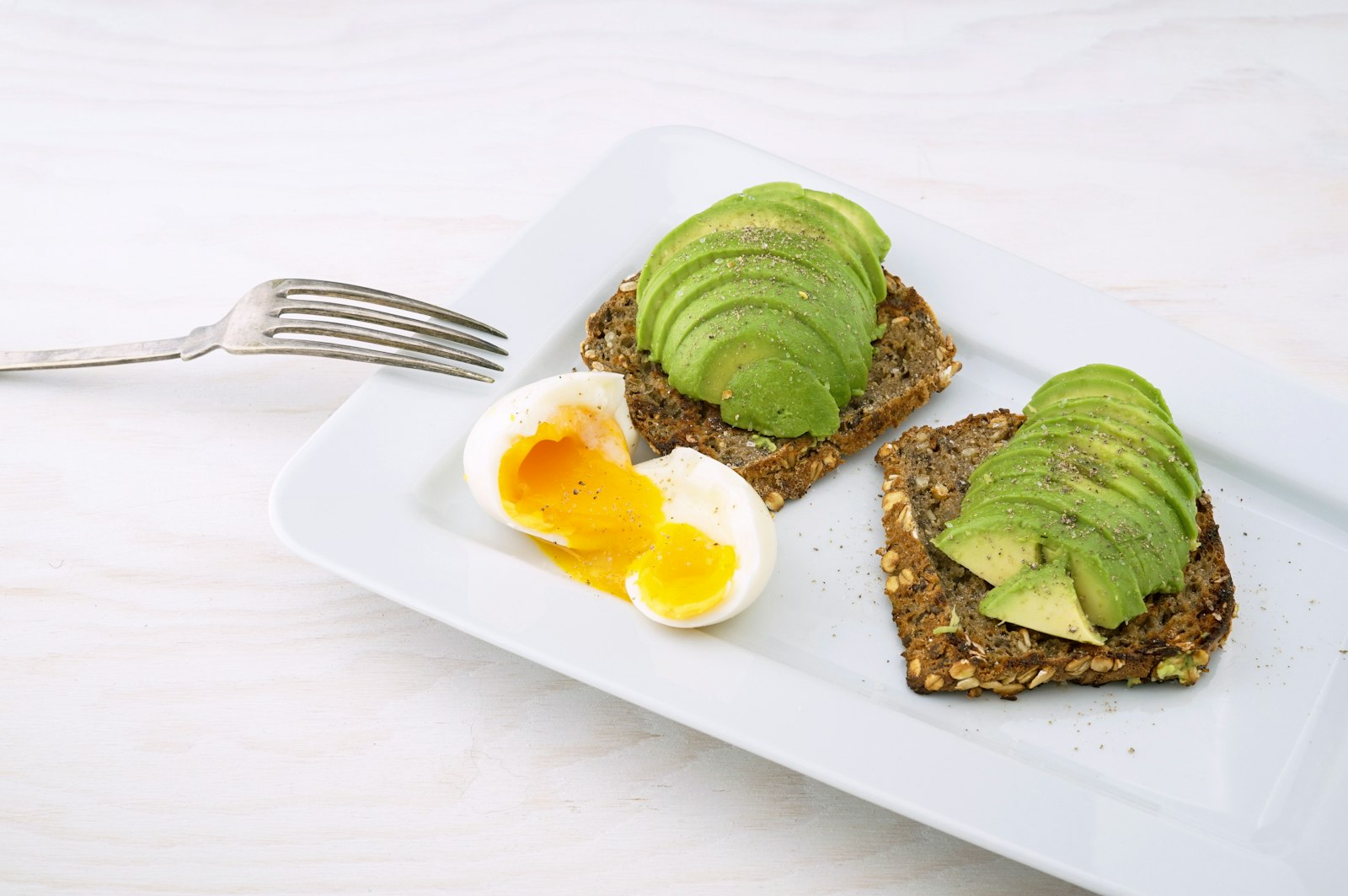 Avocado toast with soft boiled eggs