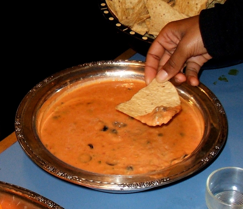 Bean and cheese dip with a tortilla chip