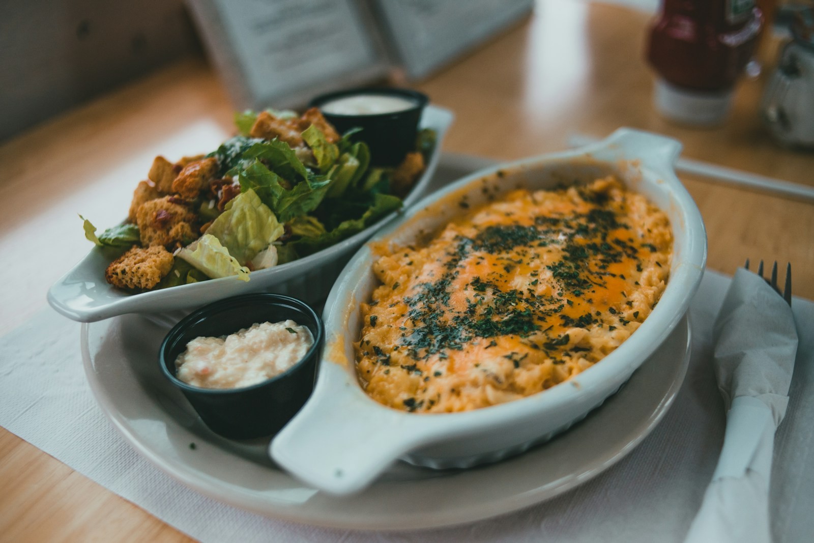Buffalo chicken dip in an oval baking dish with ranch