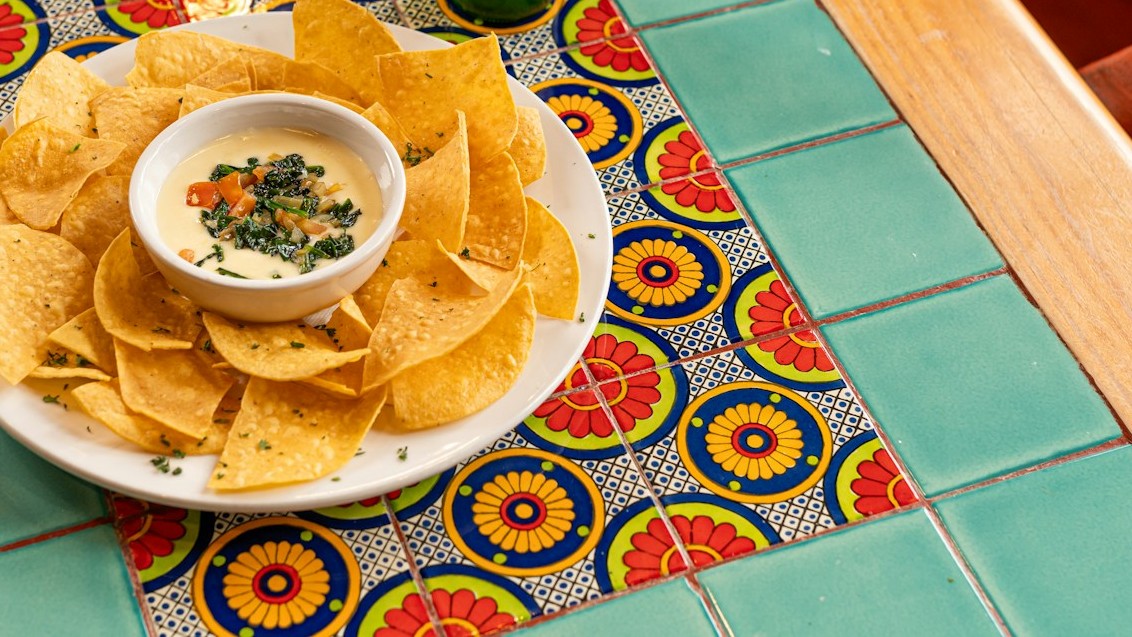 Creamy jalapeno popper spread with tortilla chips