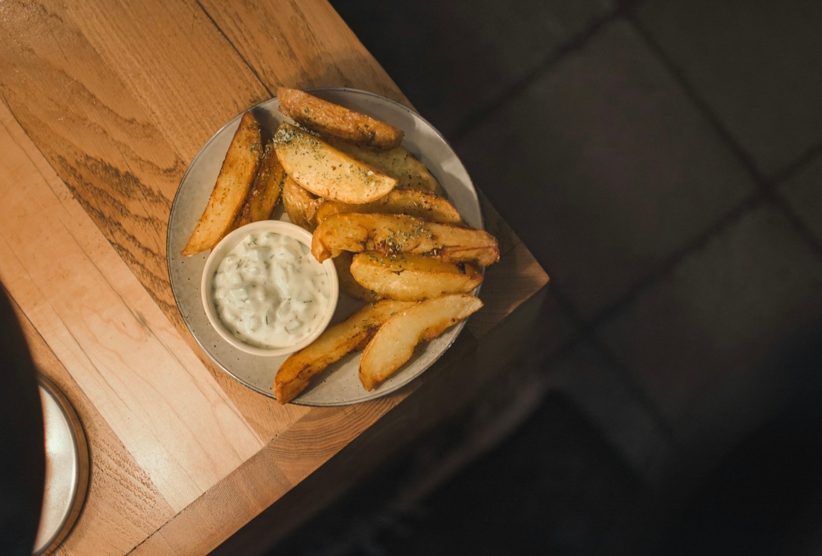 Potato wedges with a creamy sour cream and chive topping