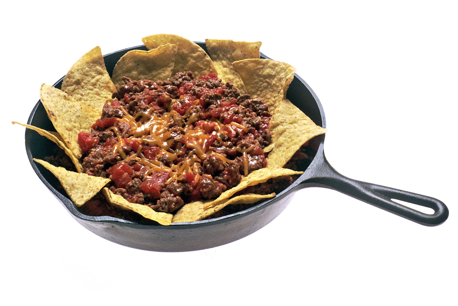 Ground beef and bean taco filling in a cast iron skillet with chips