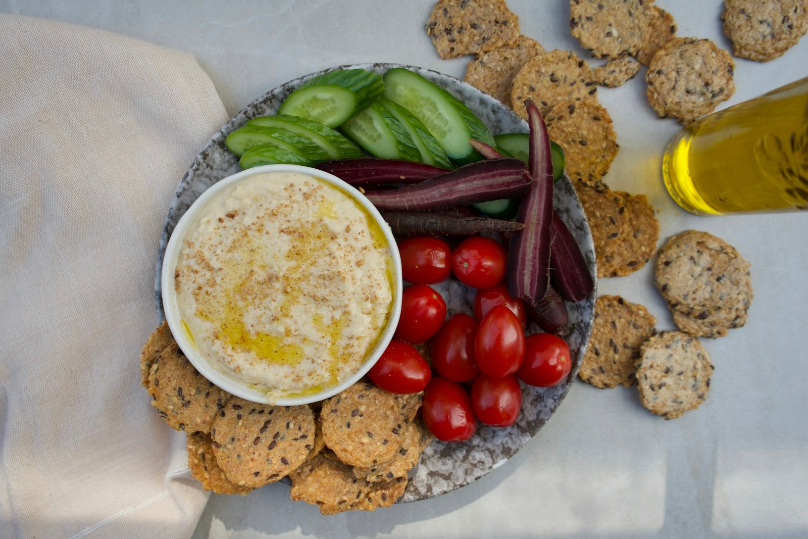 Warm spread with crackers and fresh vegetable dippers