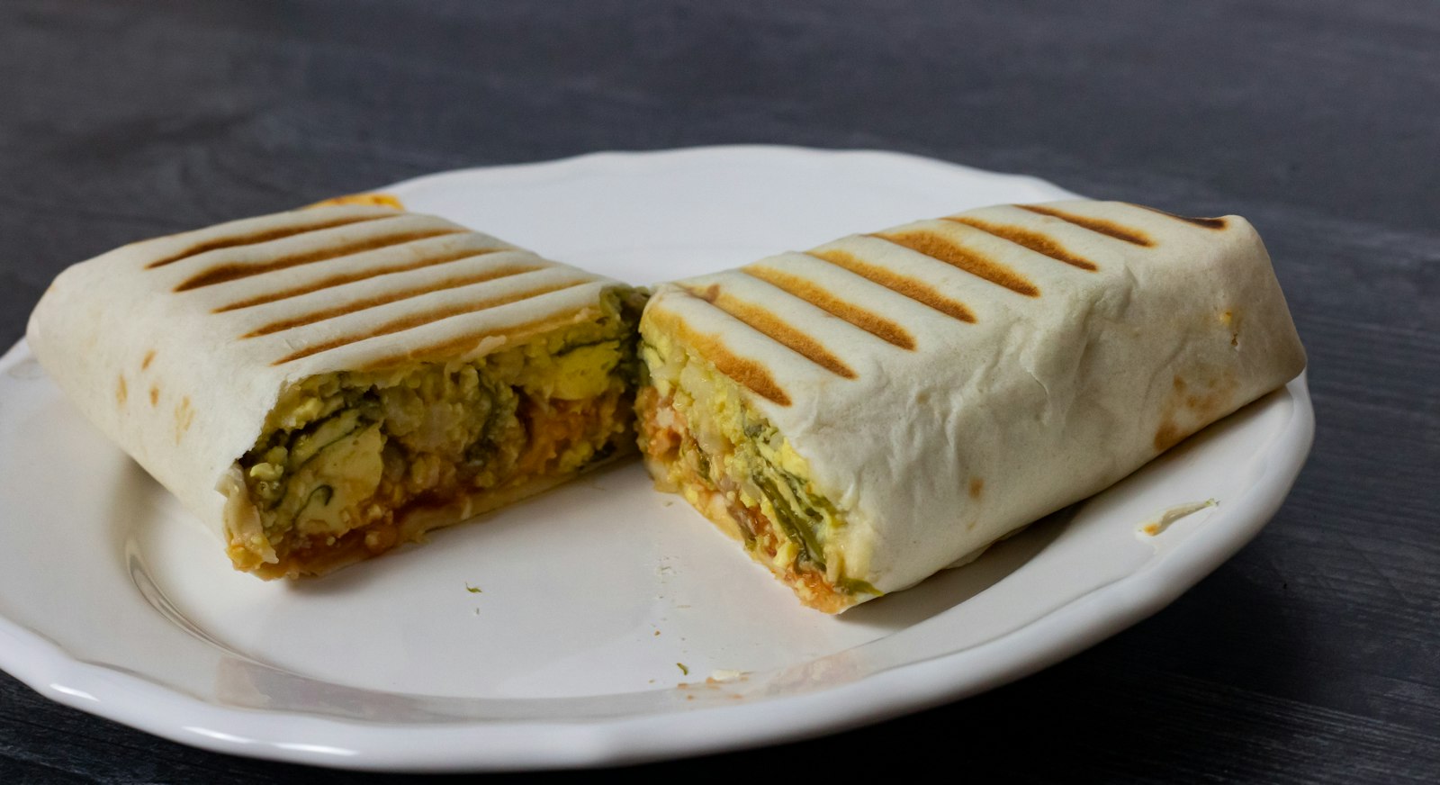 Grilled breakfast burrito cut in half