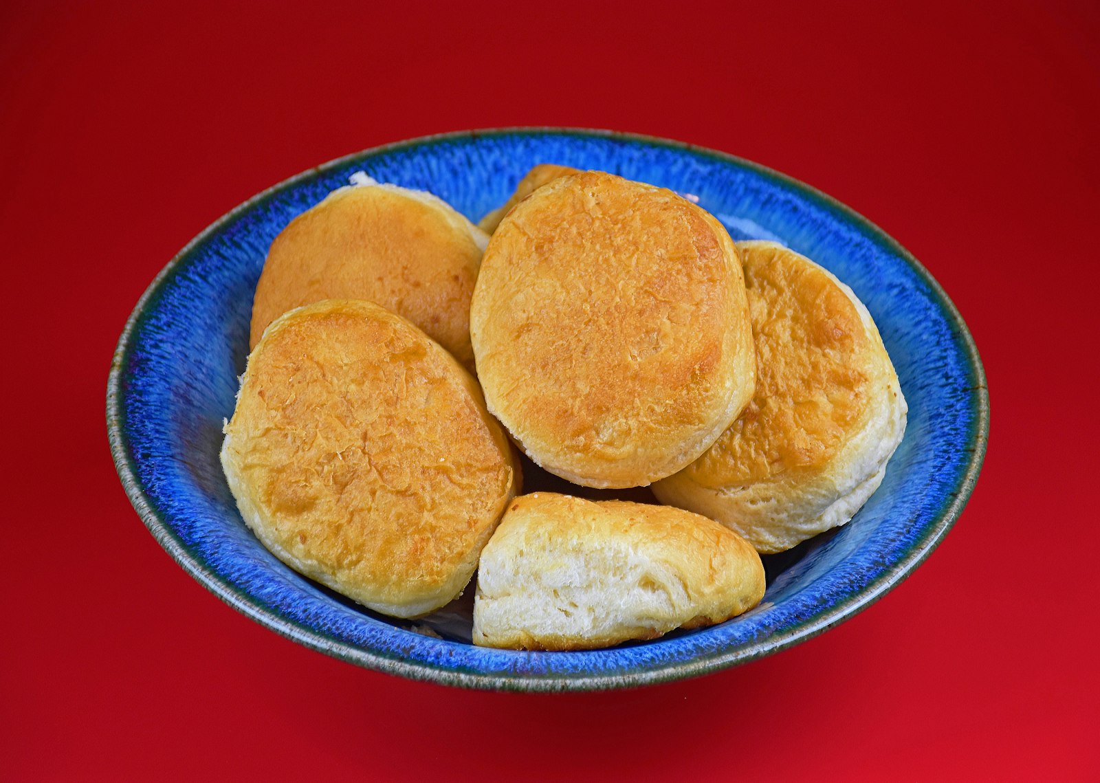 Fluffy buttermilk biscuits on a blue plate