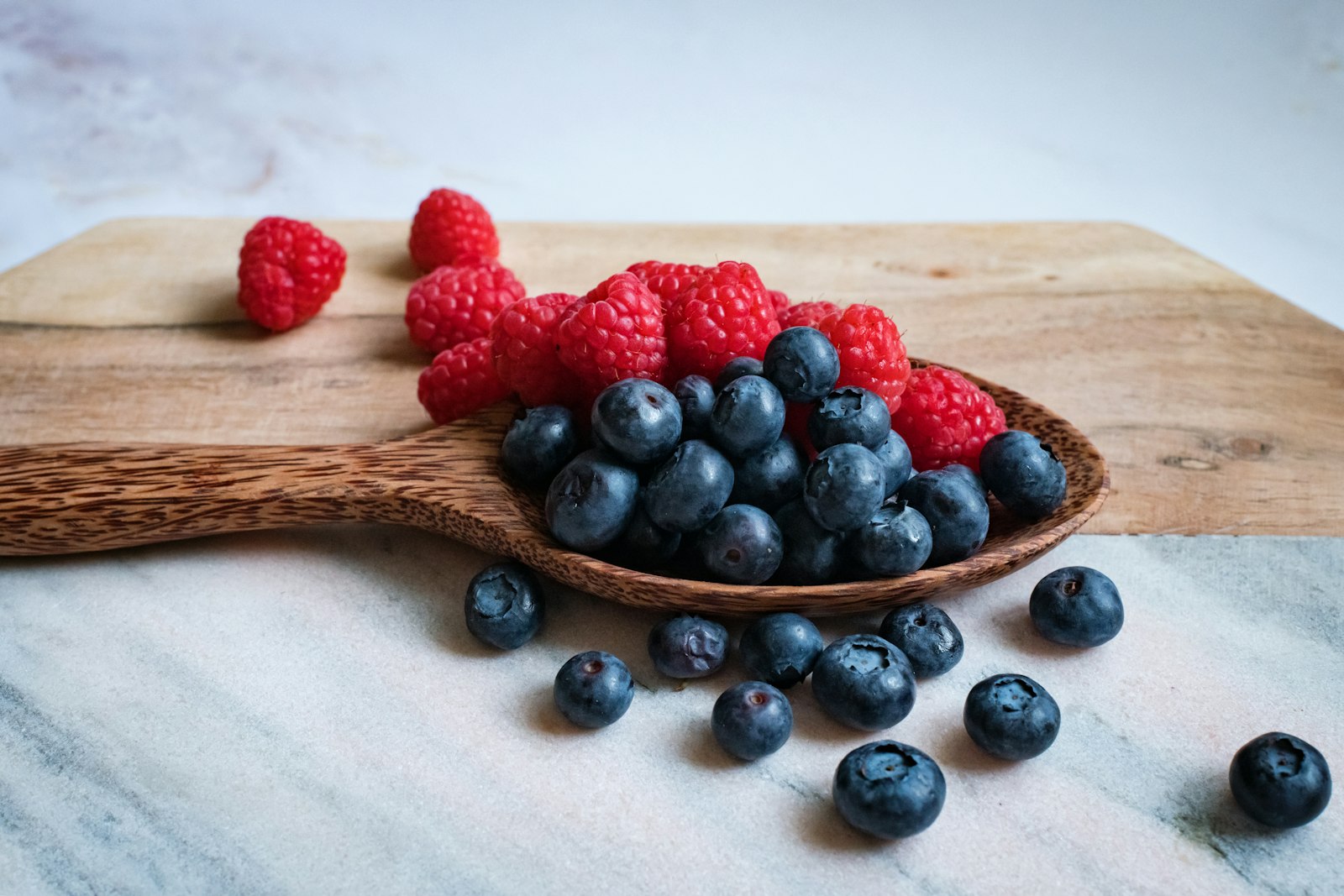 Blackberries on a wooden spoon