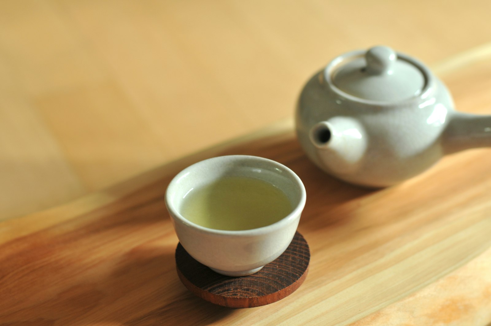 White teacup on a wooden table