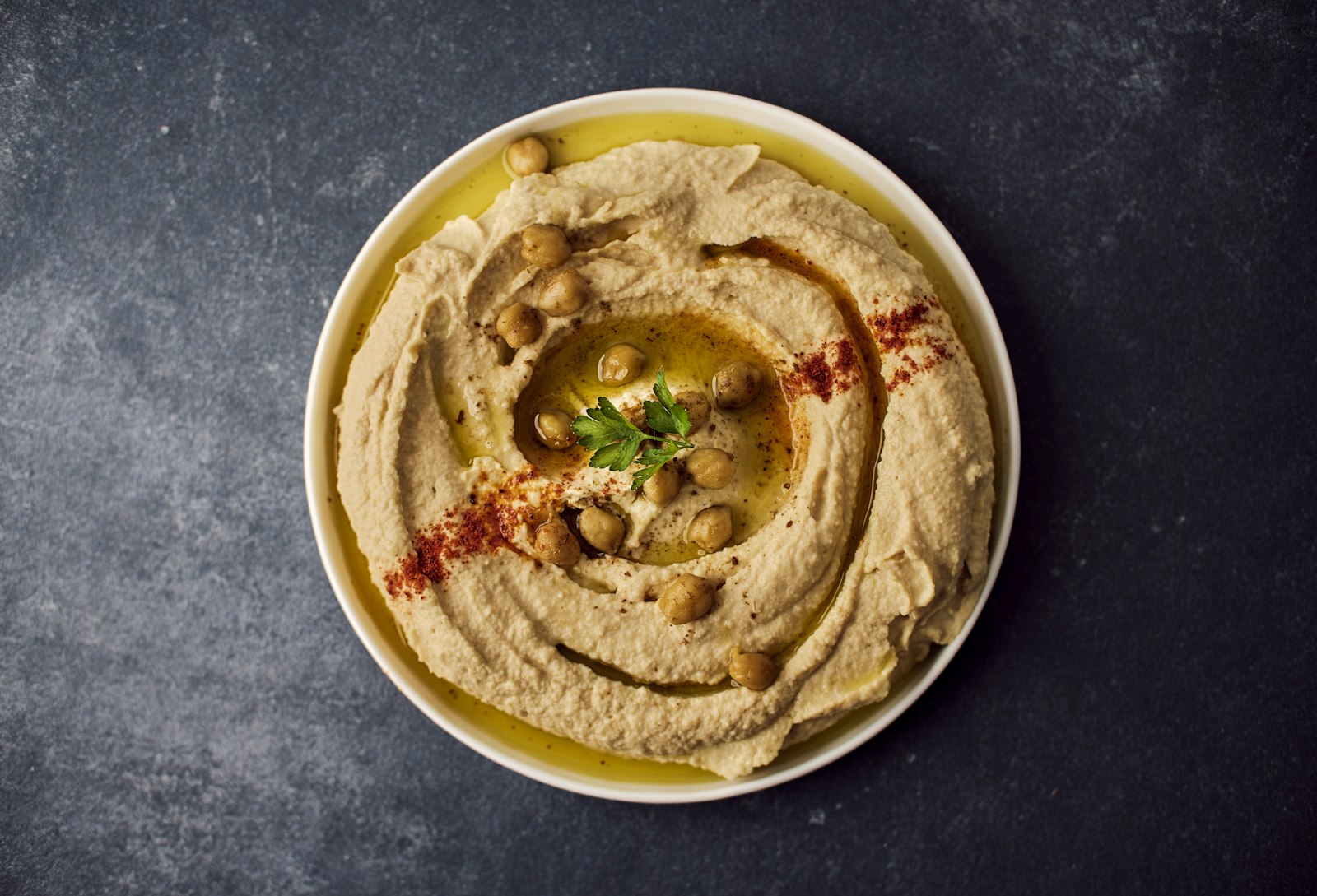 Bowl of hummus with garnish