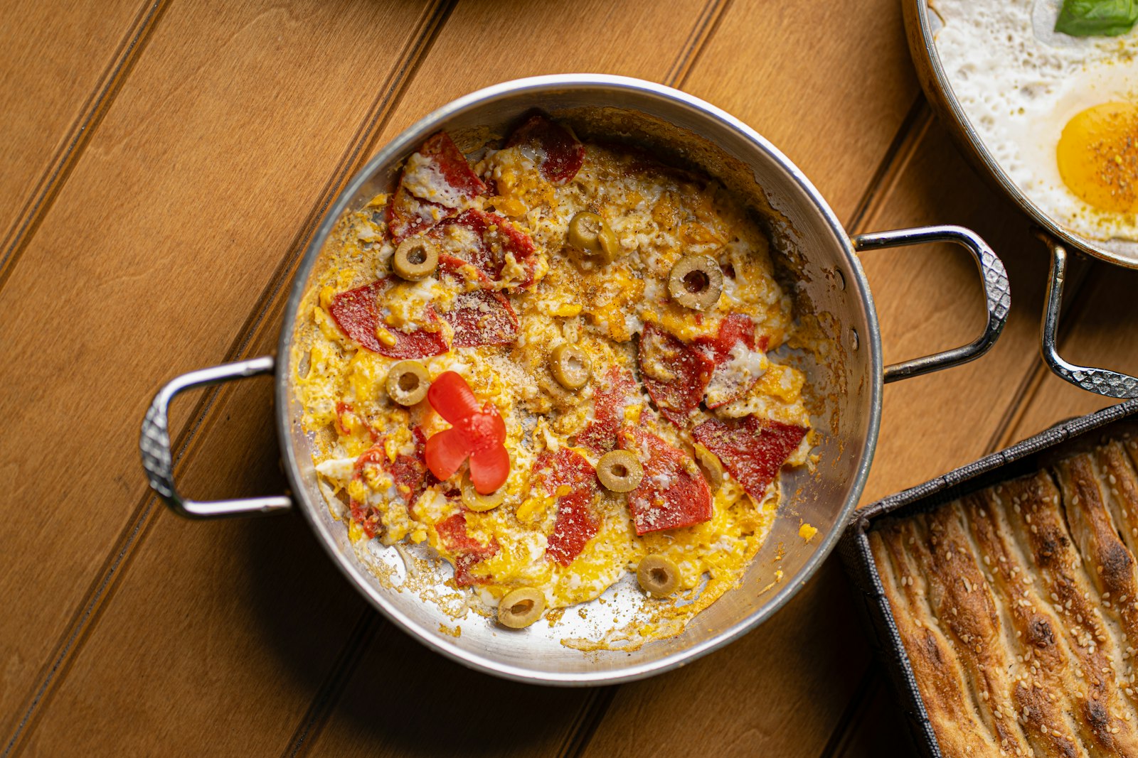 Scrambled eggs with tomatoes and olives