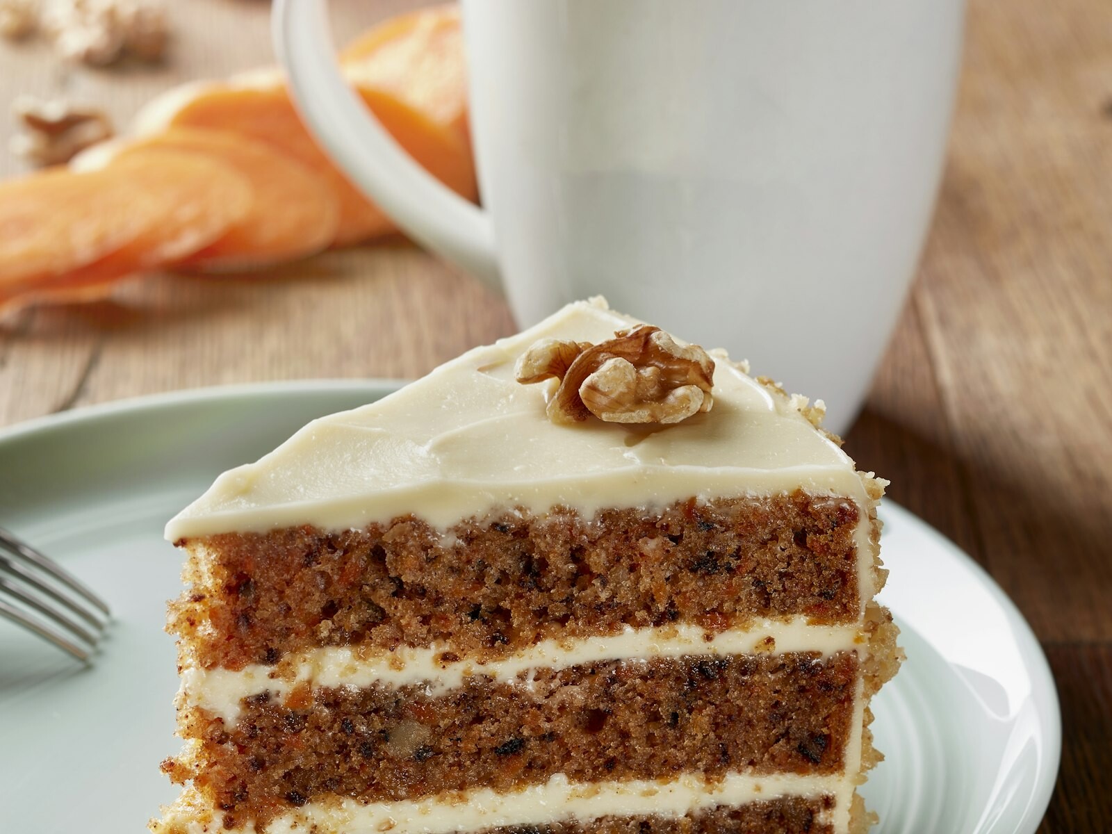 Slice of carrot cake with cream cheese frosting