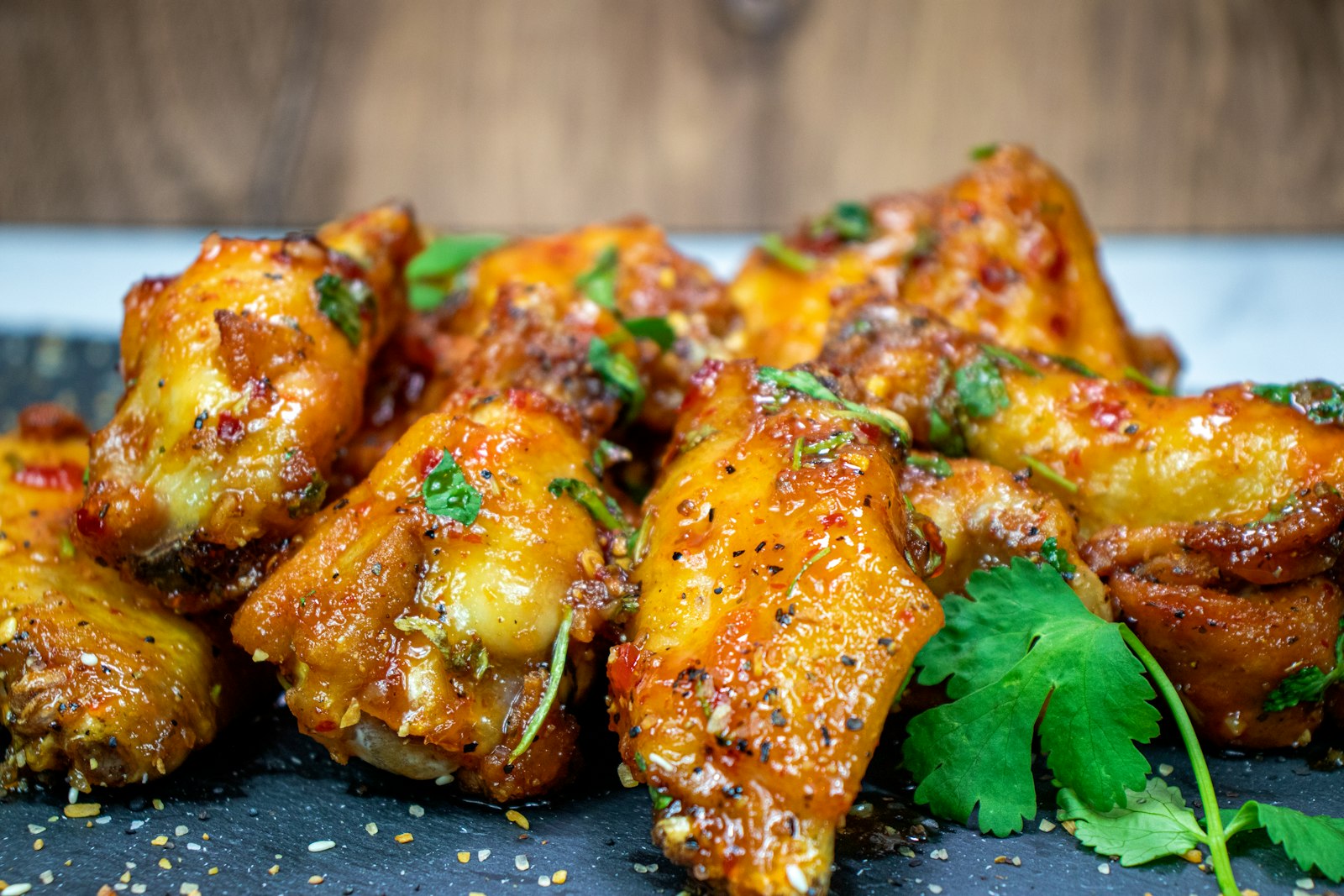 Saucy chicken wings on a platter
