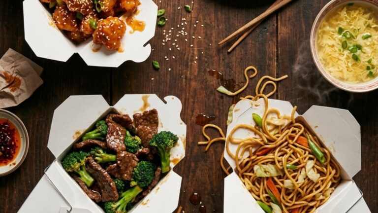 Chinese takeout copycats: orange chicken in a takeout box with egg rolls, crab rangoon and egg drop soup