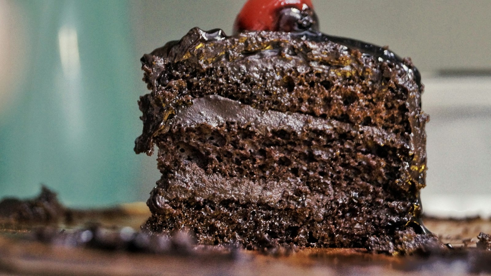 Tall slice of chocolate fudge layer cake