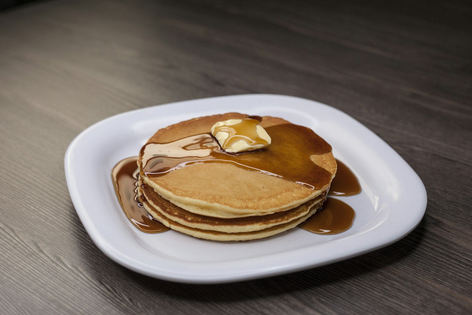 Pancakes with butter and syrup