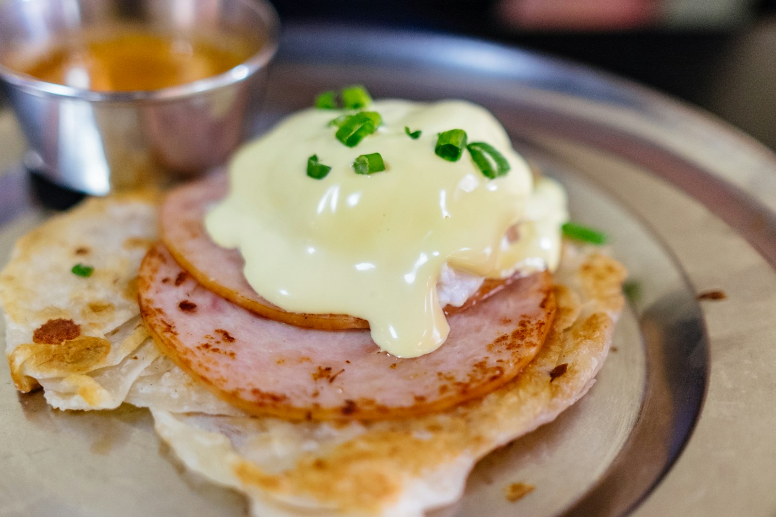 Eggs benedict with hollandaise and chives, one of our favorite brunch recipes