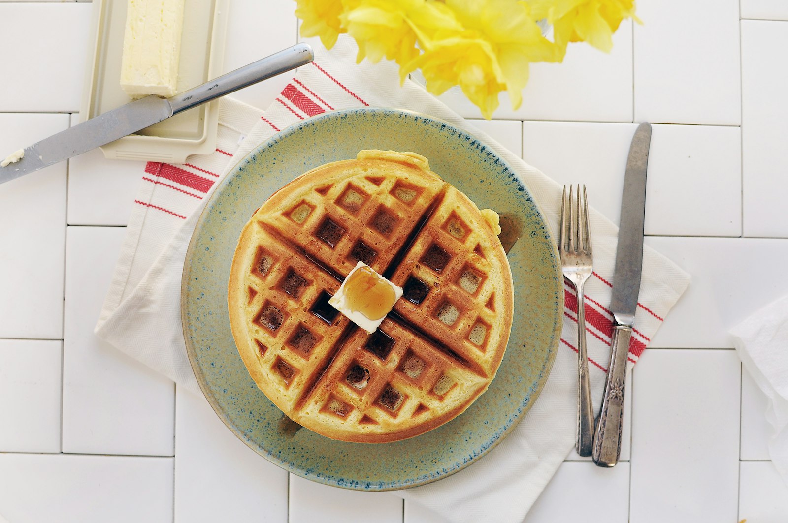 Crispy Belgian waffle on a plate, one of our favorite brunch recipes