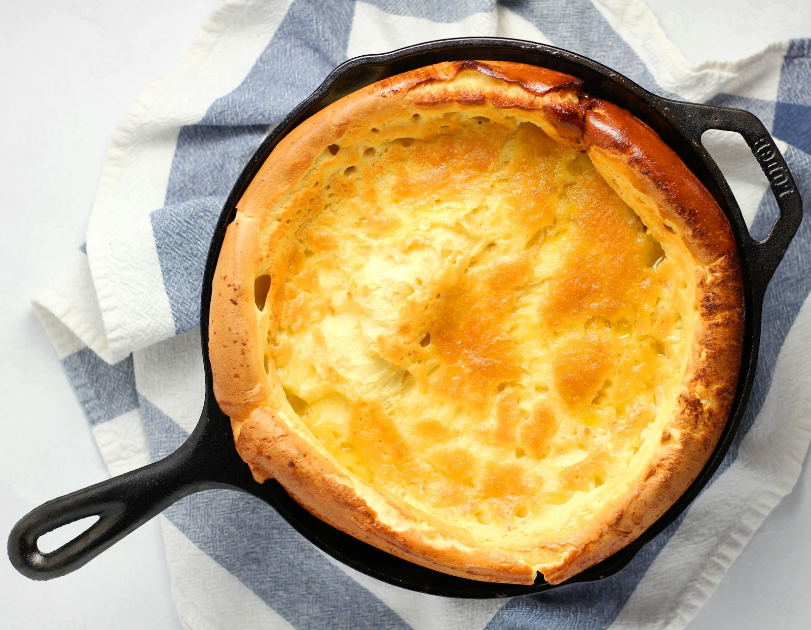 Puffy Dutch baby pancake in a skillet