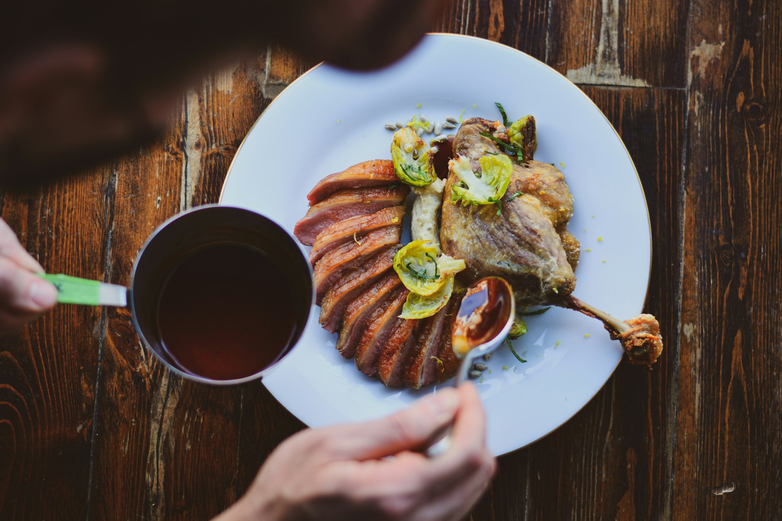 Duck confit with sauce on a plate