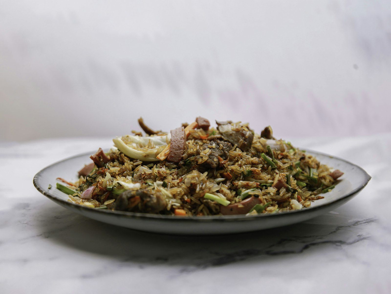 Chicken fried rice on a white plate