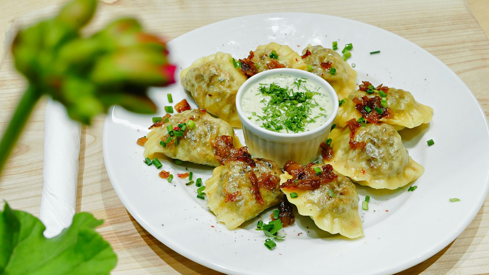 Potato and cheese pierogi with sour cream dip