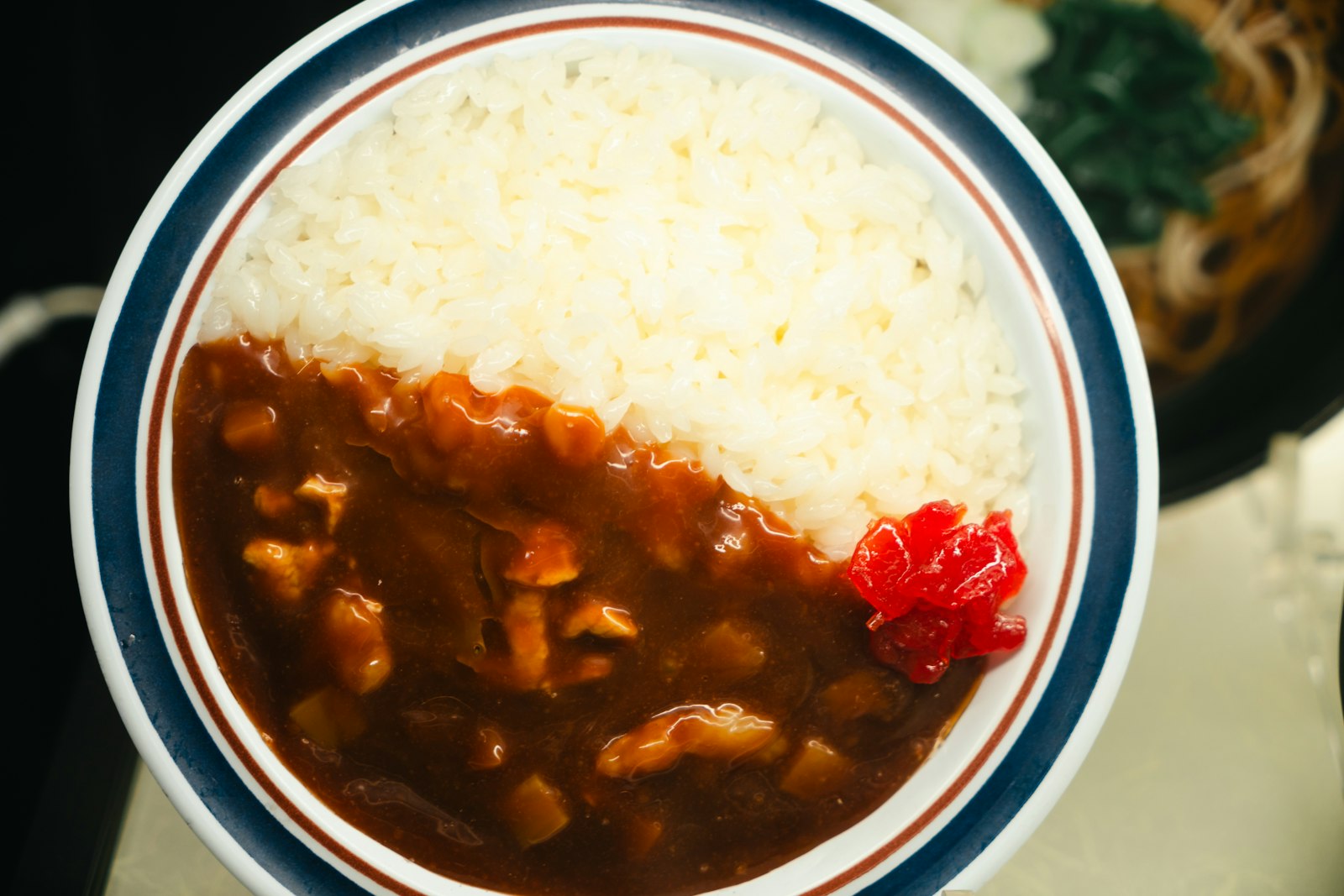 Curry rice with potatoes and carrots in thick sauce