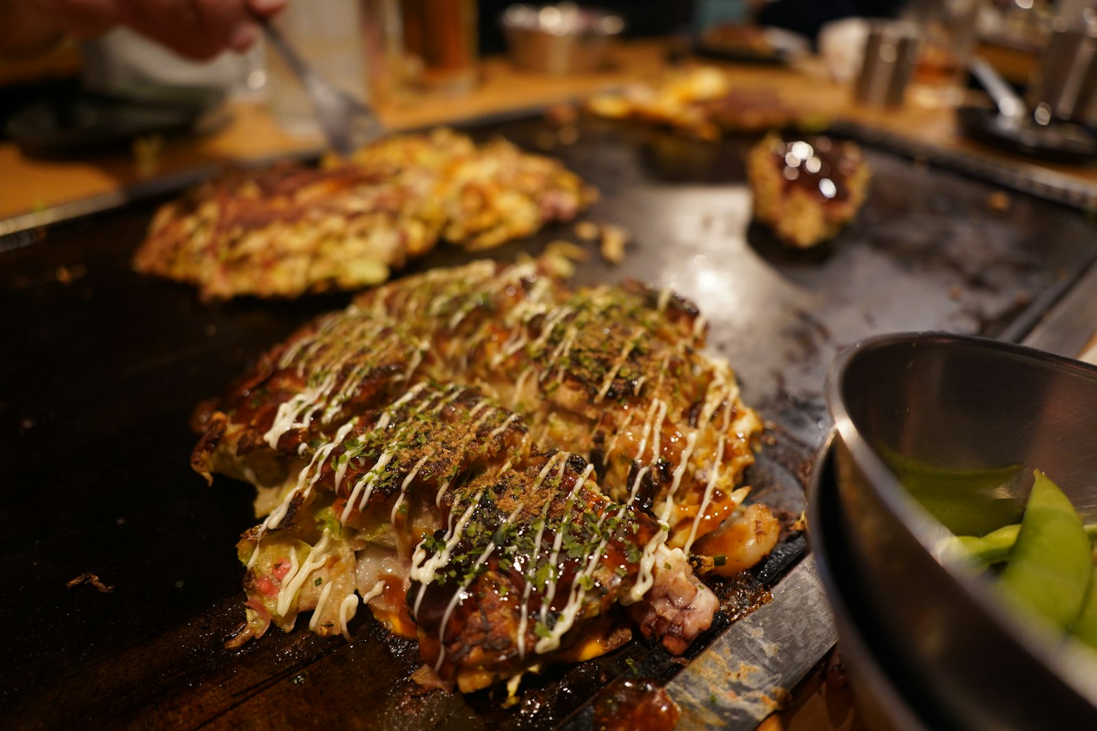 Okonomiyaki savory pancake with mayo and bonito flakes