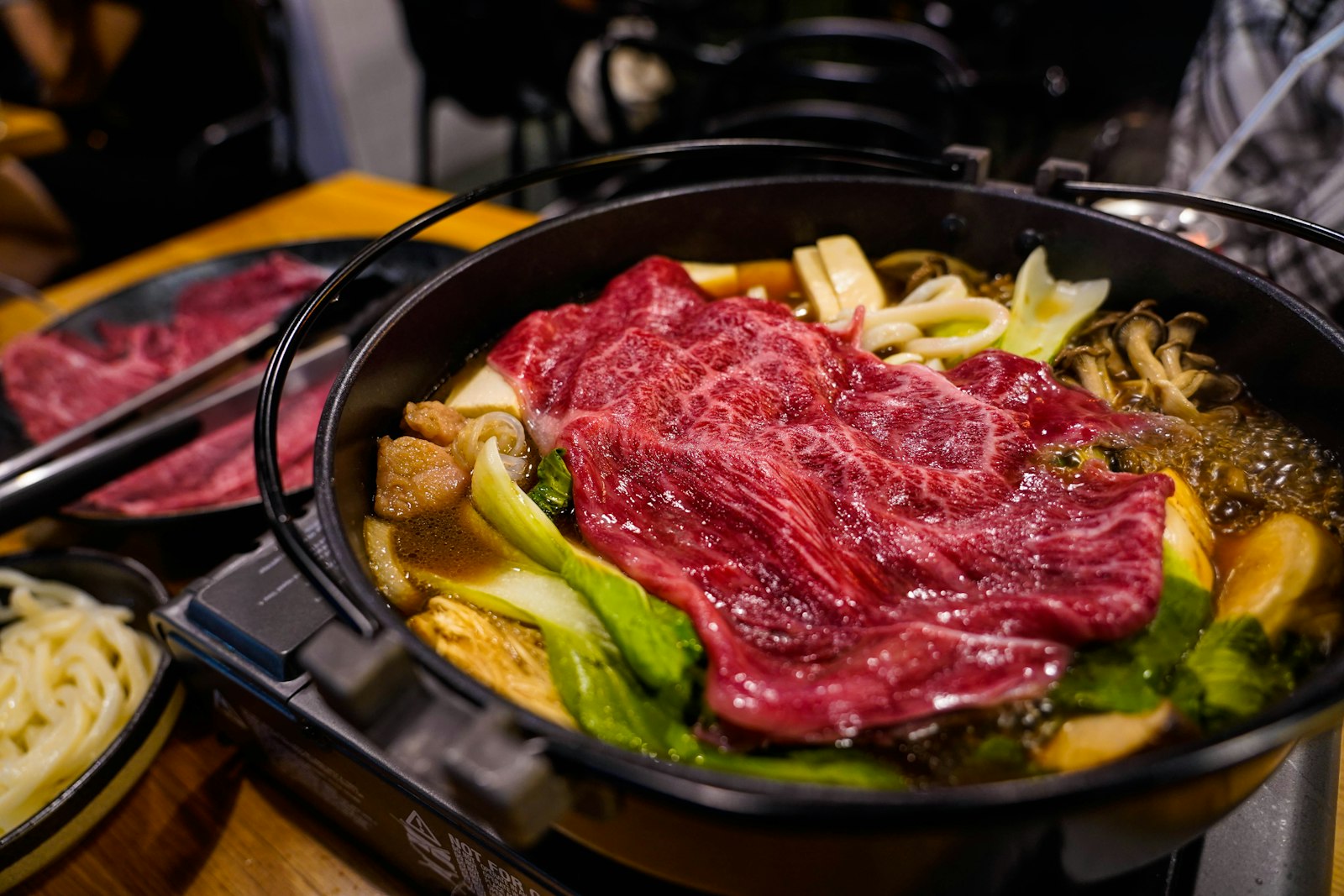 Sukiyaki hot pot with thin sliced beef and leeks