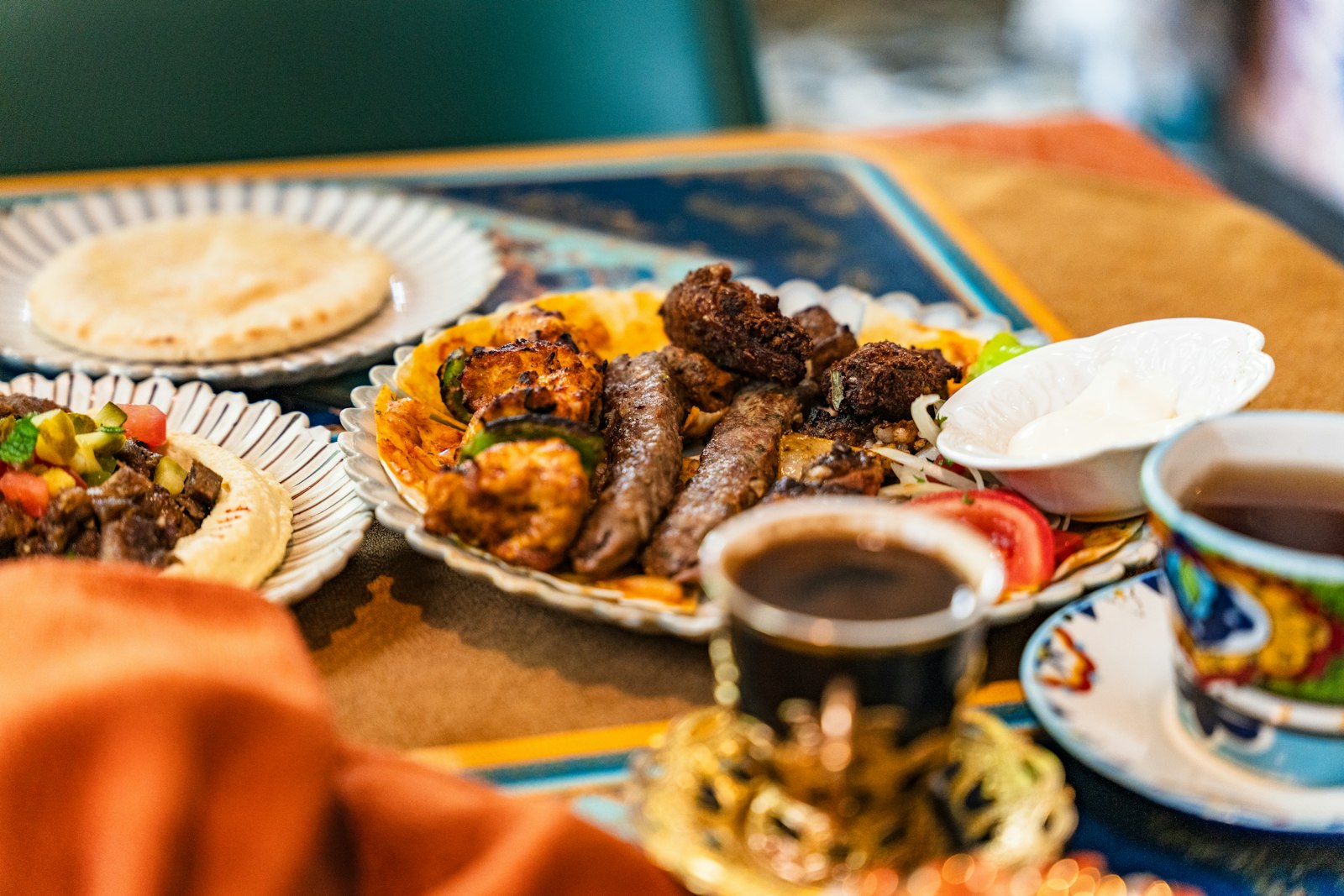 Grilled kofta kebabs with flatbread and dips