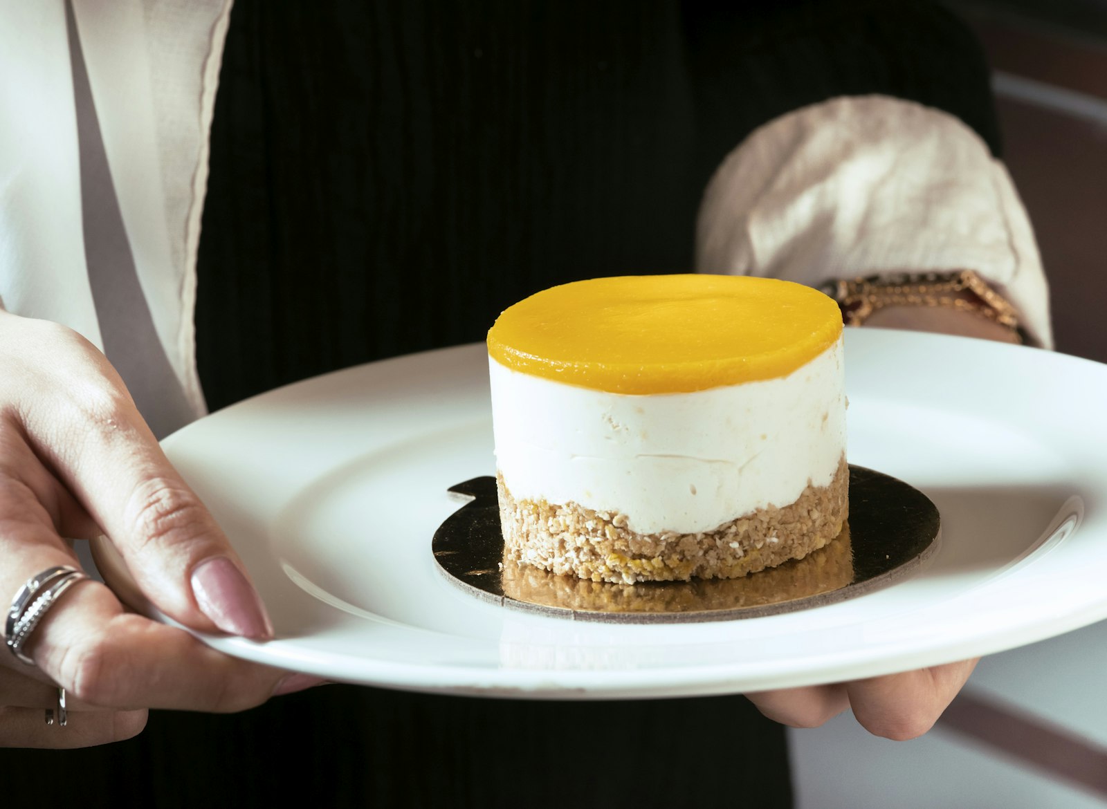 Cheesecake with a glossy golden fruit topping