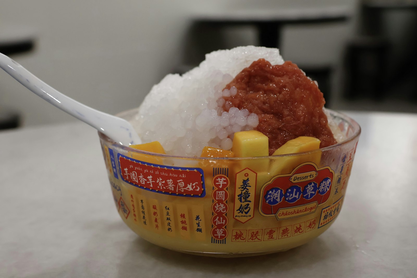 Fruit topped shaved ice in a bowl