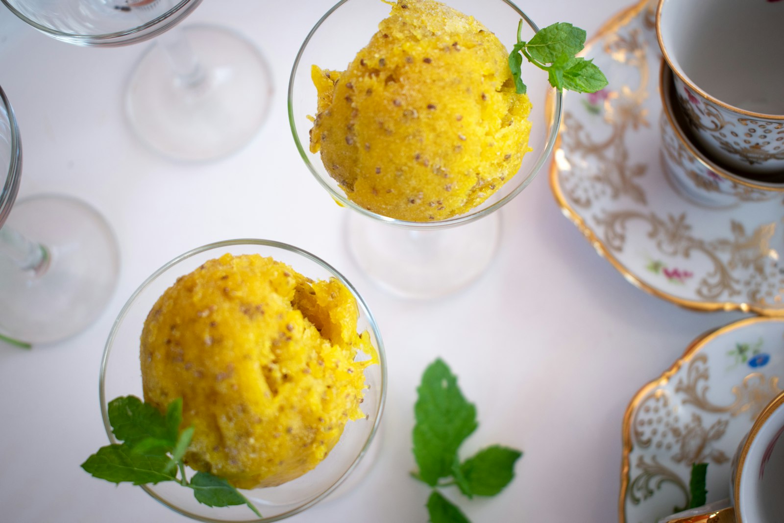 Bright orange sorbet in glass bowls