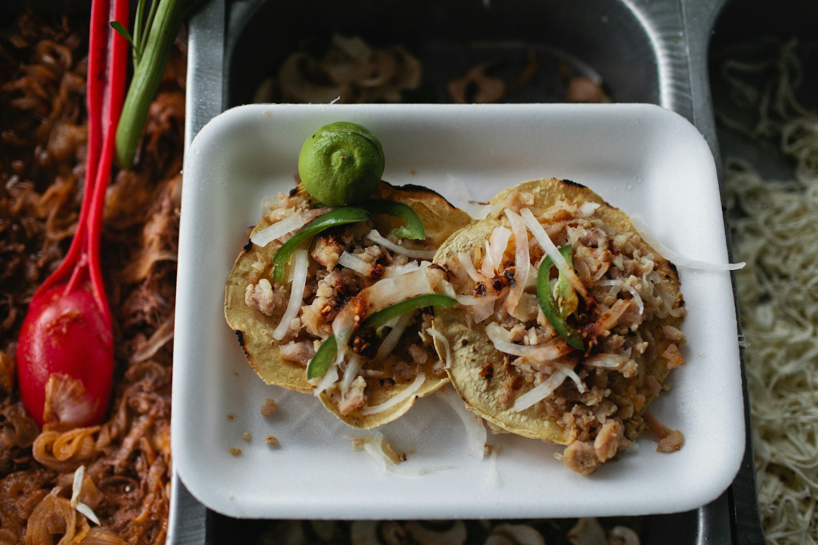 Mexican dinner recipes pork carnitas on corn tortillas with lime