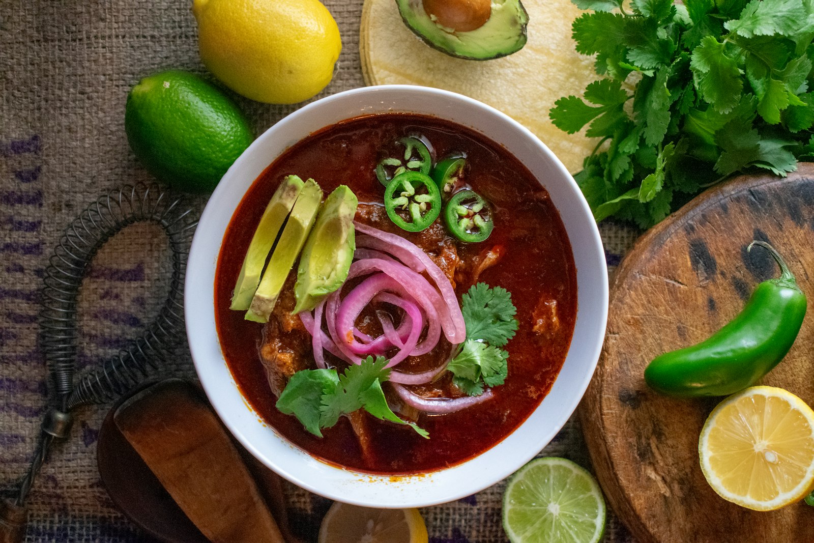Mexican dinner recipes red pozole with pickled onion and avocado