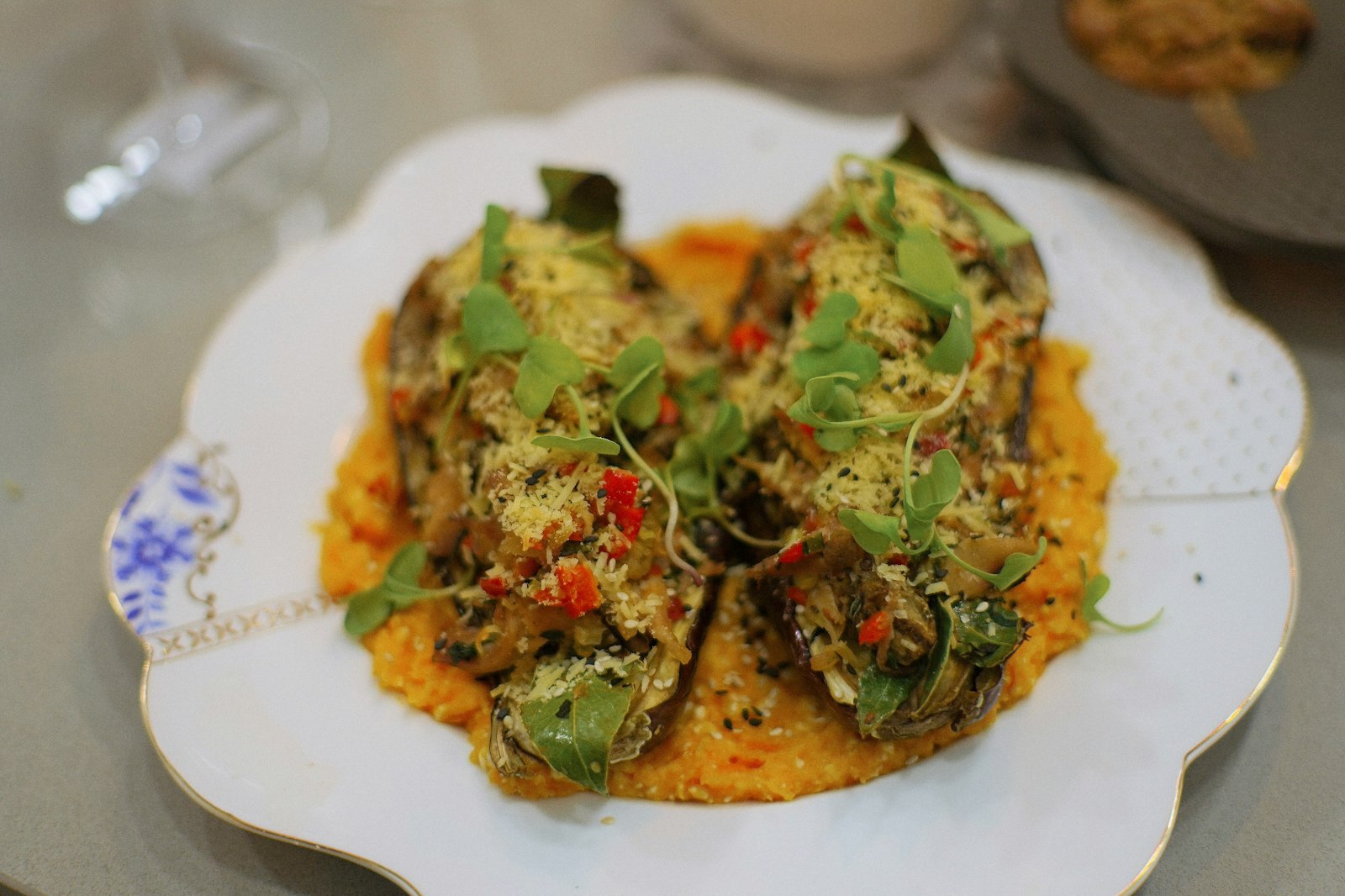 Baked stuffed poblano peppers with herbs on a white plate
