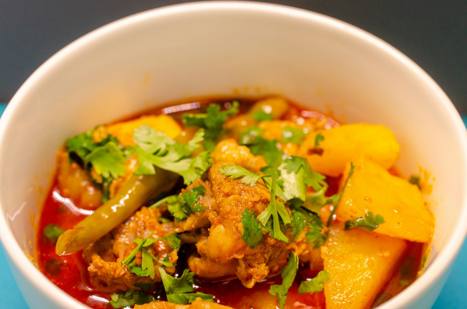Rich mutton korma in a serving dish